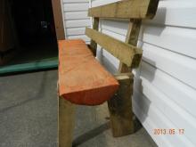 A bench with legs and backrest